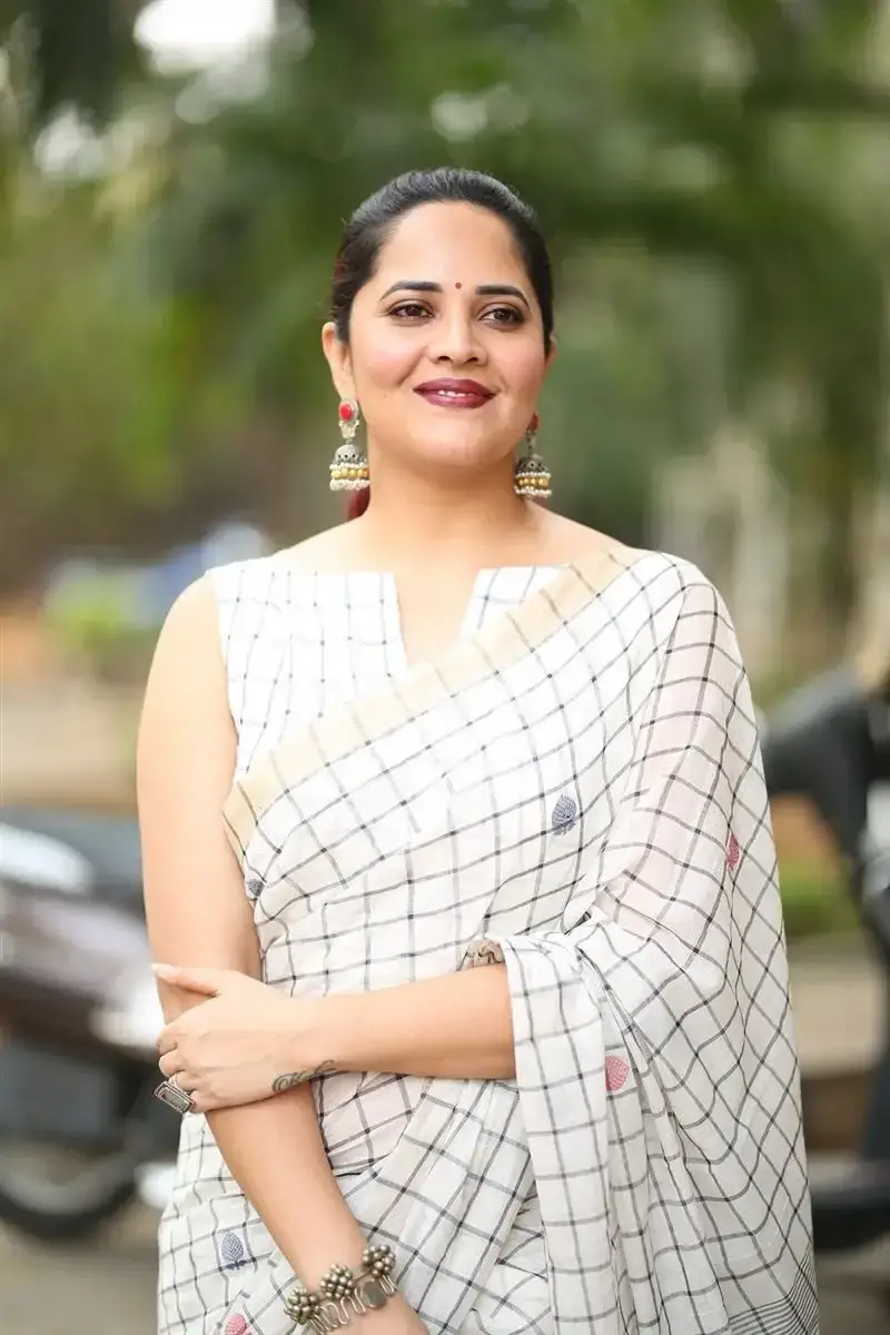 Anasuya Bharadwaj in White Saree at Razakar Movie Launch